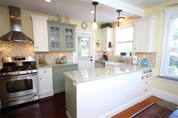 48 Banks Road Swampscott, MA 01907 - Photo 9 of 28 a kitchen with stainless steel appliances granite countertop a sink a stove and a wooden floor