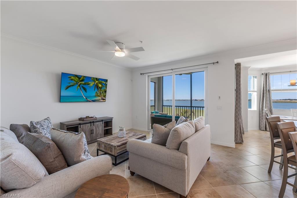 43020 Greenway Boulevard, Unit 333 Babcock Ranch, FL 33982 - Photo 2 of 11 a living room with furniture a couch and a flat screen tv
