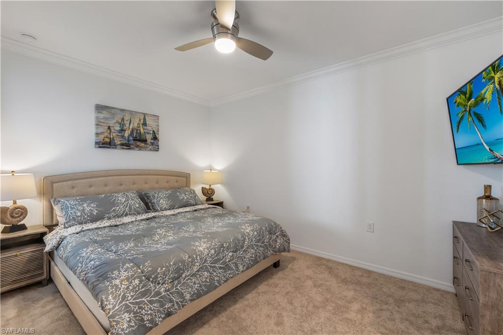 43020 Greenway Boulevard, Unit 333 Babcock Ranch, FL 33982 - Photo 8 of 11 a bedroom with a bed and a flat screen tv