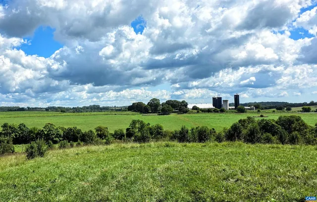 a view of a golf course with green space