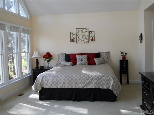 2957 Tillinghast Trail Raleigh, NC 27613 - Photo 9 of 25 Spacious master suite has door leading to 3 seasons room.