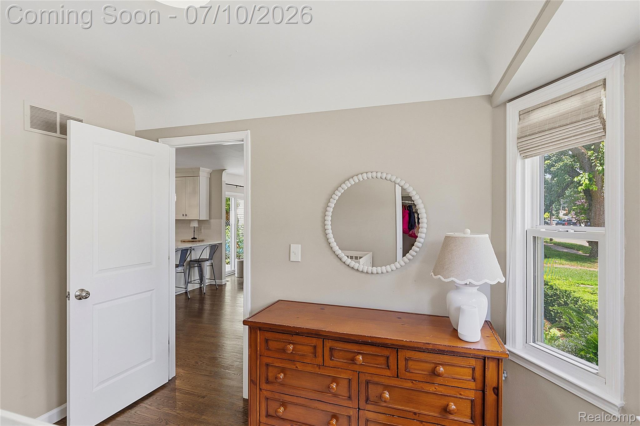 3295 Cumberland Road Berkley, MI 48072 - Photo 12 of 32 Interior space featuring a window with a fabric roman shade, wood-finish flooring, and light-toned wall paint