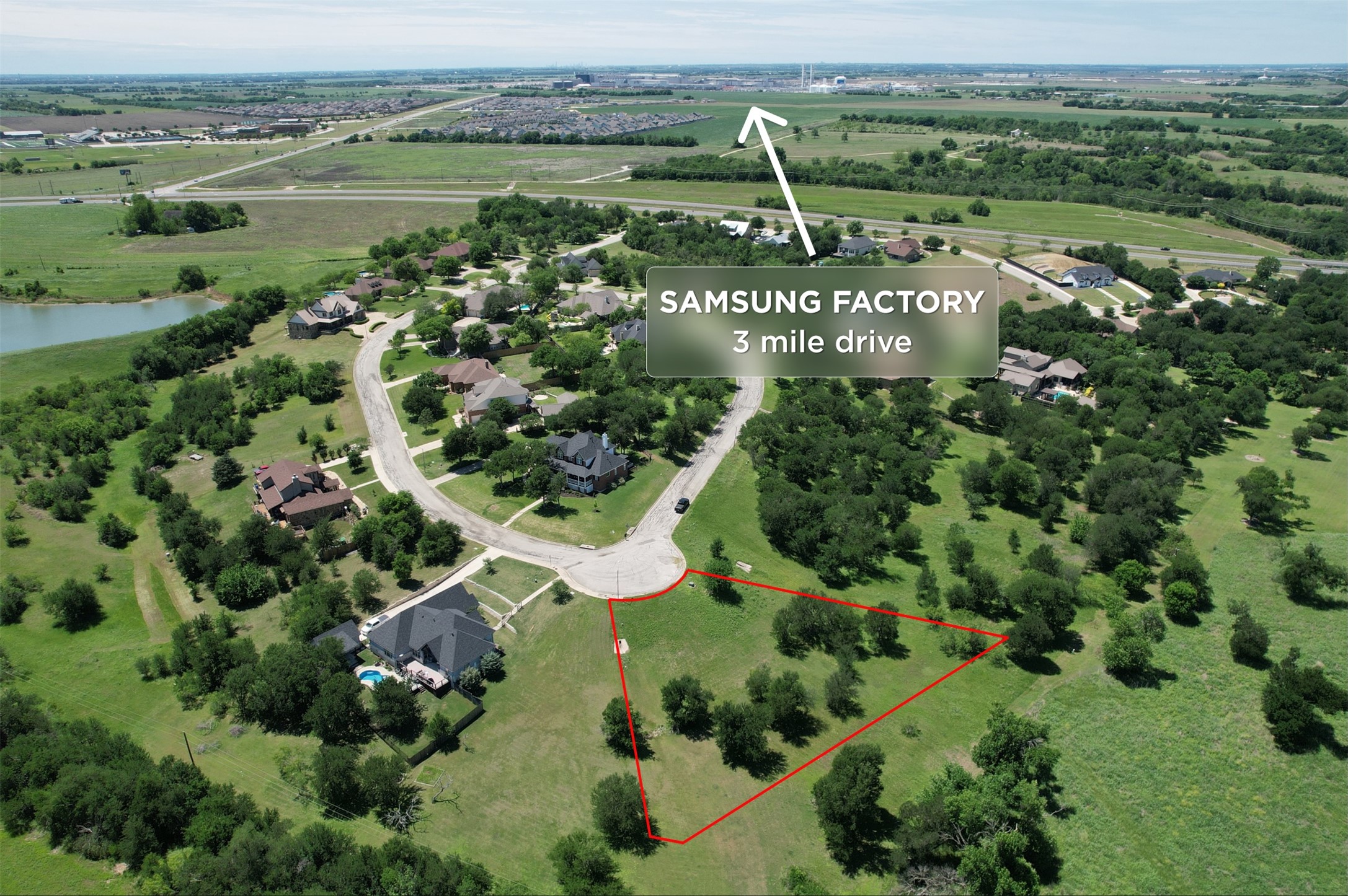 1700 Tanner Loop Taylor, TX 76574 - Photo 3 of 32 Expansive land parcel outlined in red, featuring mature trees and green landscaping