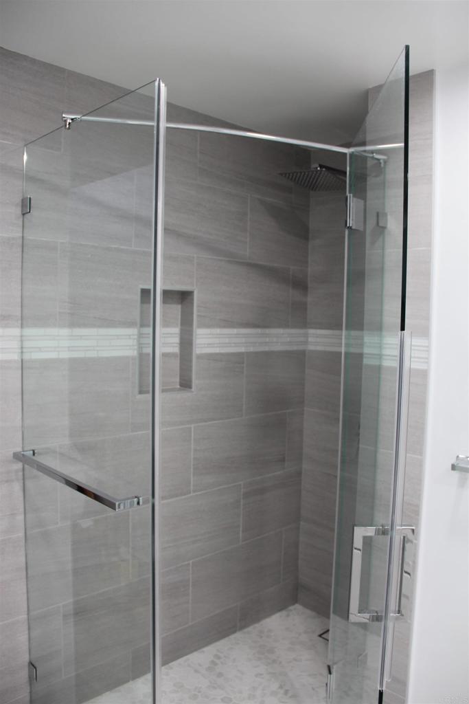 922 Sealane Drive, Unit B Encinitas, CA 92024 - Photo 17 of 30 a bathroom with a glass shower door