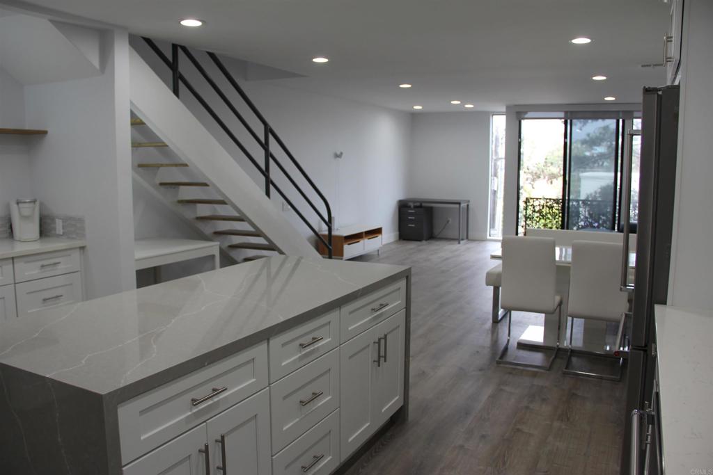 922 Sealane Drive, Unit B Encinitas, CA 92024 - Photo 2 of 30 a view of a hallway with wooden floor and staircase