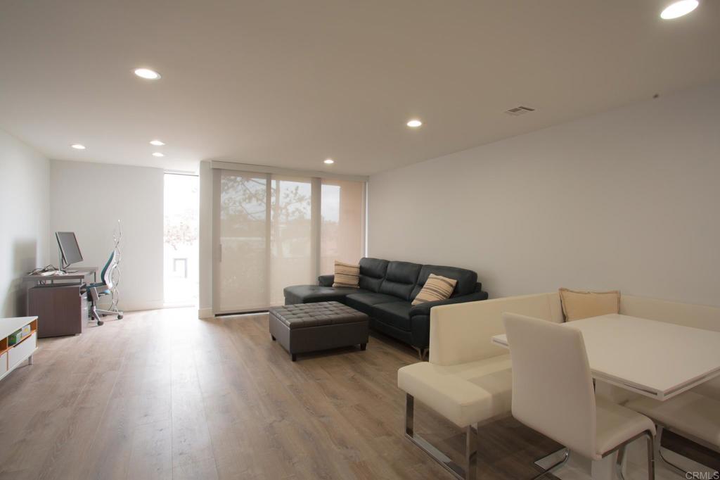 922 Sealane Drive, Unit B Encinitas, CA 92024 - Photo 6 of 30 a living room with furniture and large windows