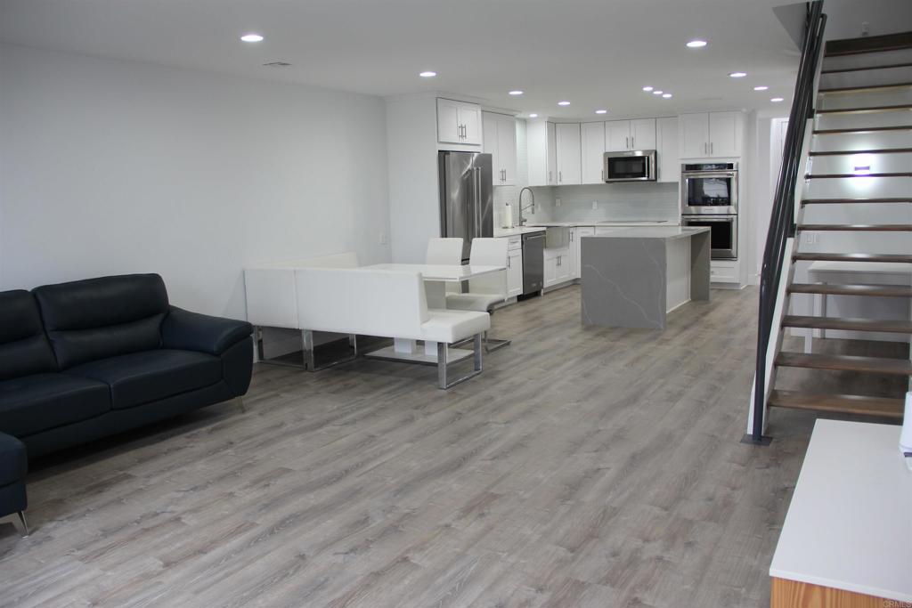 922 Sealane Drive, Unit B Encinitas, CA 92024 - Photo 8 of 30 a living room with furniture and kitchen view