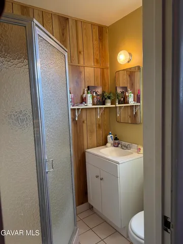 a room with a sink toilet and vanity