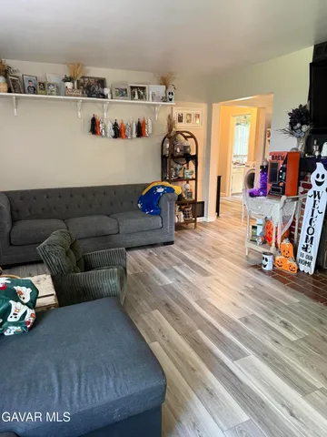 a view of a livingroom with furniture and toys