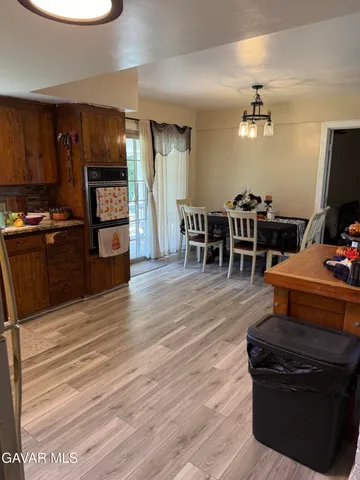 a kitchen with granite countertop a stove and a refrigerator