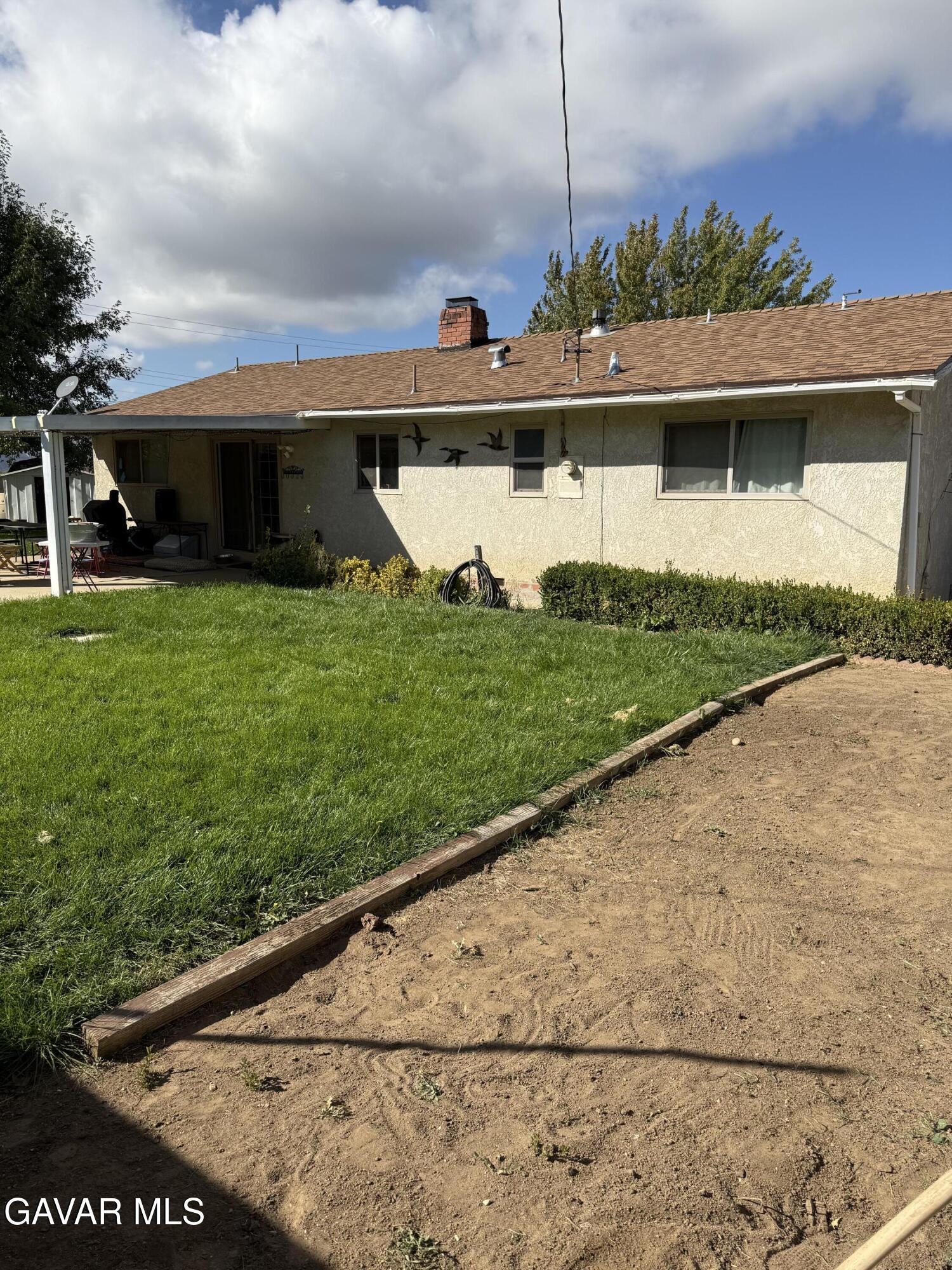 919 Golden W Court Tehachapi, CA 93561 - Photo 21 of 23 a front view of a house with garden