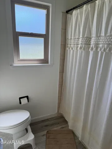 a bathroom with a toilet and a sink
