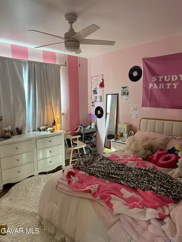 a bed room with a bed and a dresser