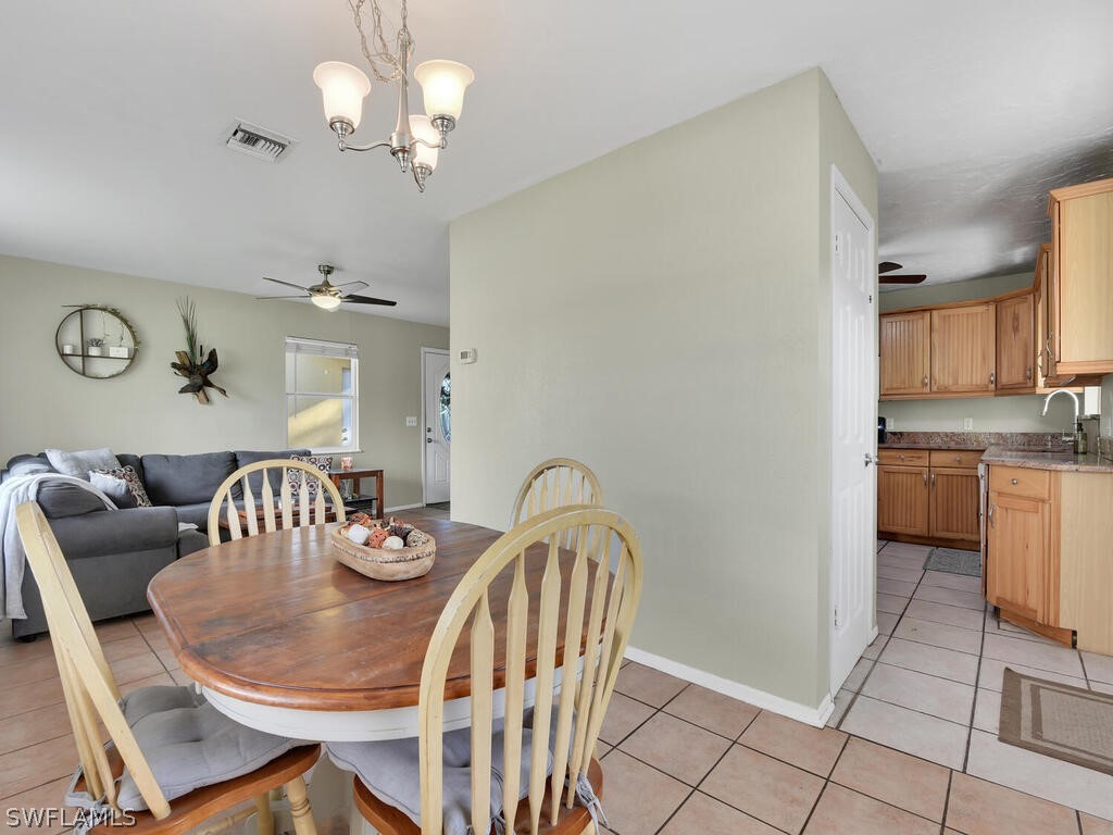 18426 Geranium Road Fort Myers, FL 33967 - Photo 5 of 25 a view of a dining room with furniture