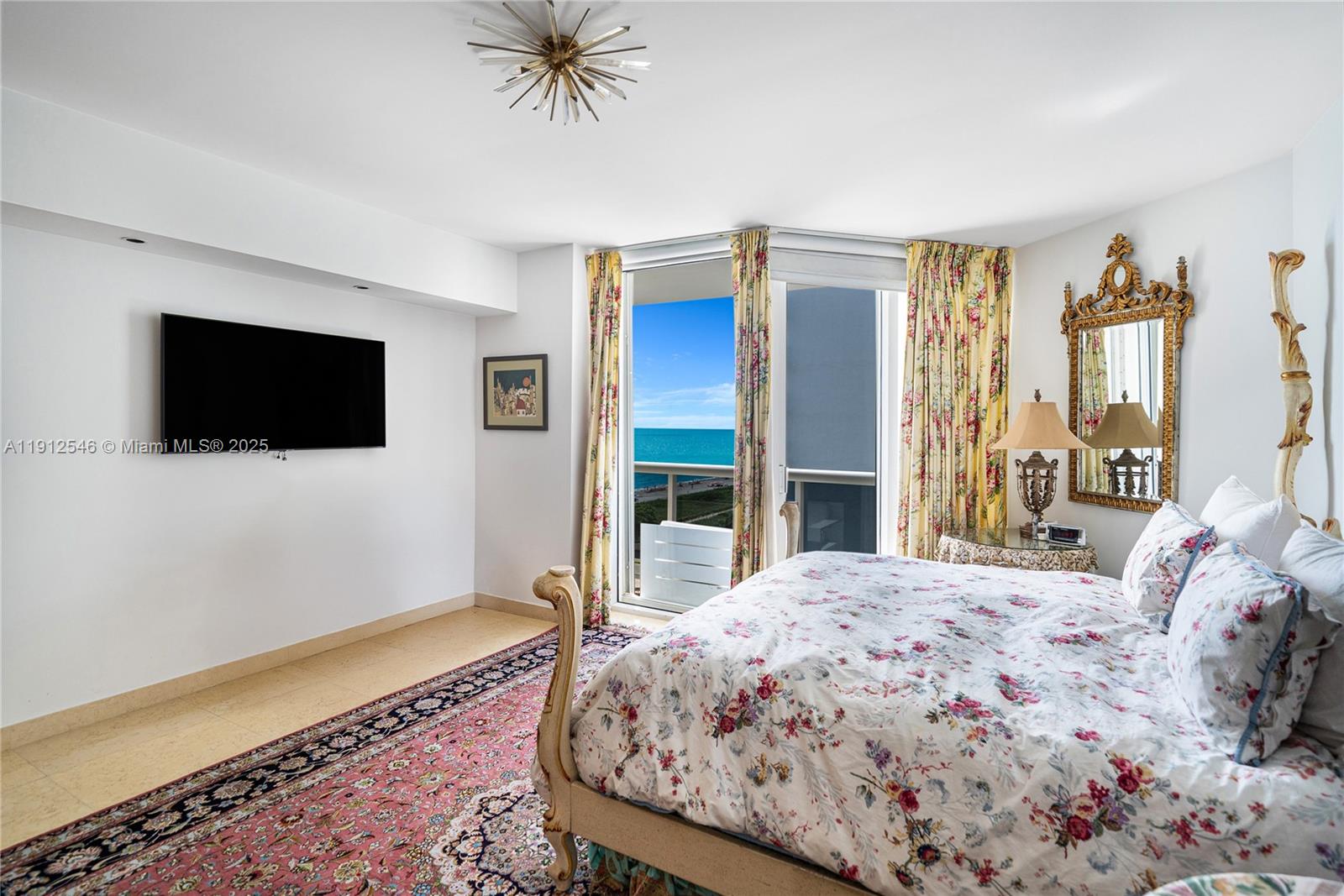 9559 Collins Avenue, Unit S7A Surfside, FL 33154 - Photo 11 of 43 a bedroom with a bed and a flat screen tv