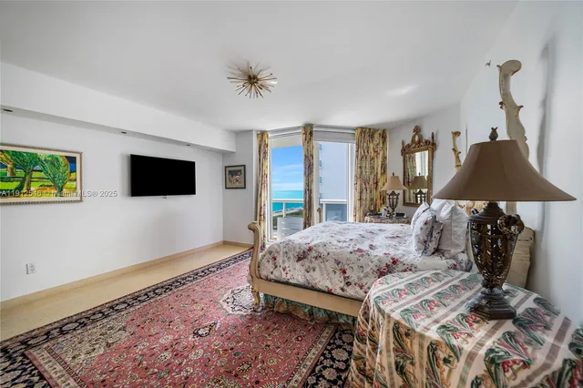 a living room with furniture rug and wooden floor
