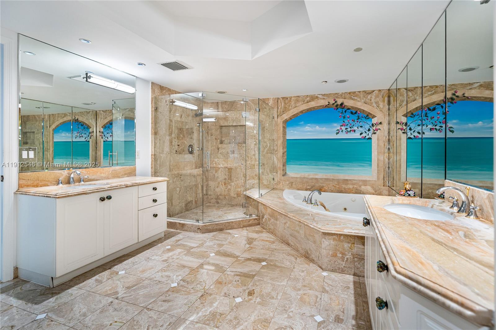 9559 Collins Avenue, Unit S7A Surfside, FL 33154 - Photo 16 of 43 a spacious bathroom with a double vanity sink a mirror and a bathtub
