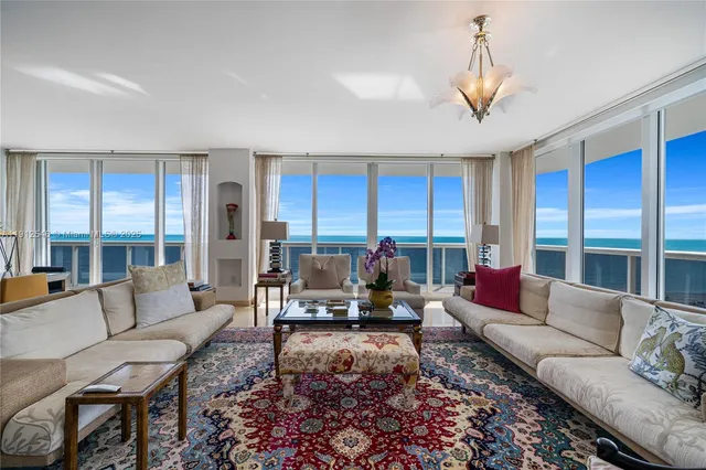 a bedroom with a bed and a lamp on dresser