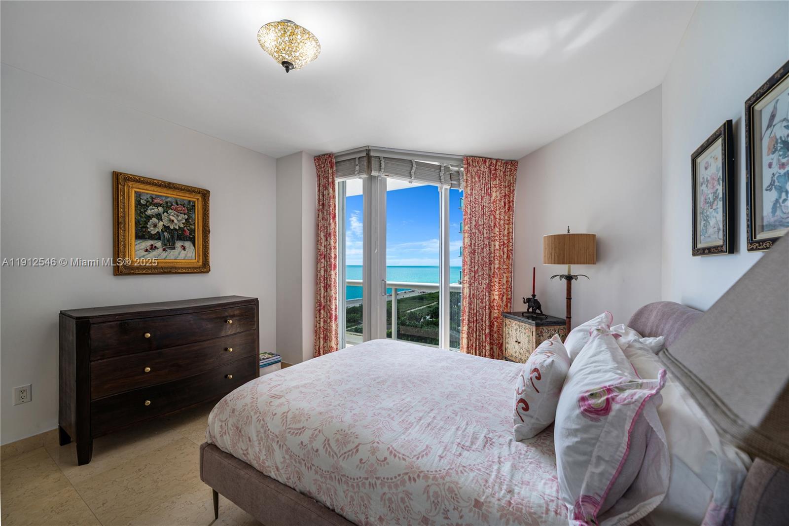 9559 Collins Avenue, Unit S7A Surfside, FL 33154 - Photo 19 of 43 a bedroom with a bed and a lamp on dresser