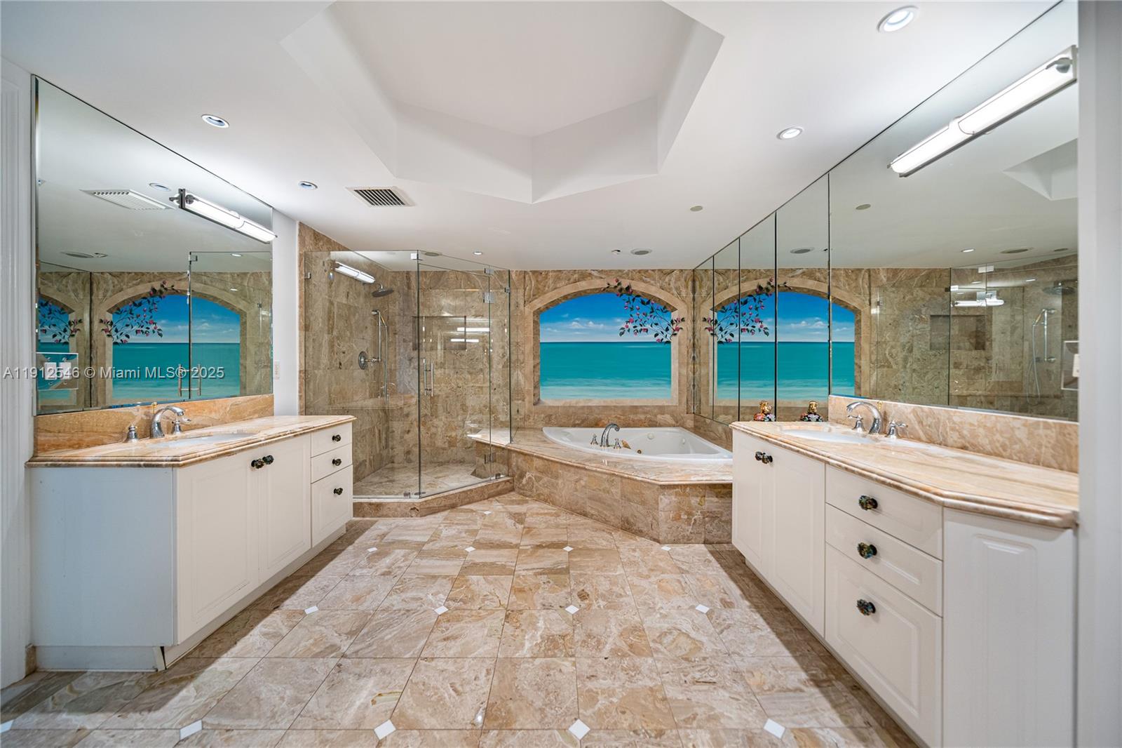 9559 Collins Avenue, Unit S7A Surfside, FL 33154 - Photo 29 of 43 a large white kitchen with a large window and stainless steel appliances