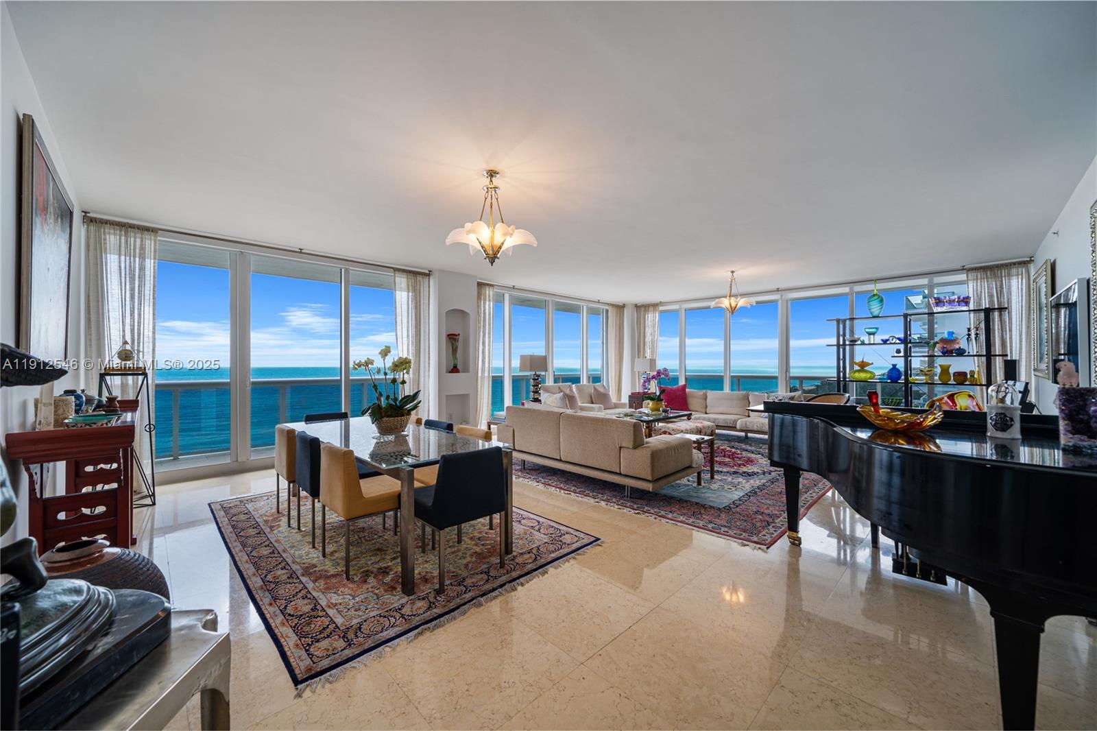 9559 Collins Avenue, Unit S7A Surfside, FL 33154 - Photo 10 of 43 a living room with furniture and a large window