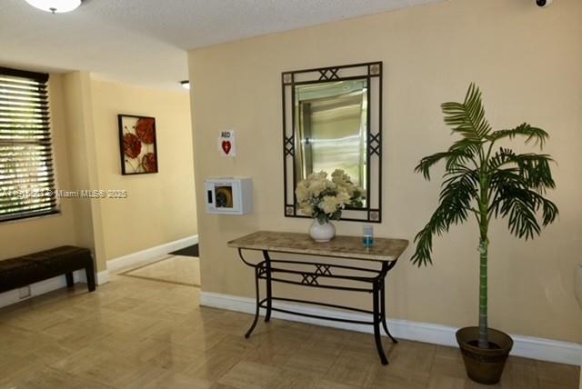 Inverrary Lauderhill, FL 33319 - Photo 11 of 15 a living room with furniture and a potted plant