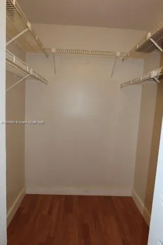 a view of a room with shelf on the wall