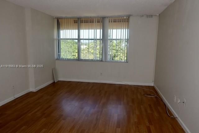 Inverrary Lauderhill, FL 33319 - Photo 9 of 15 an empty room with wooden floor and windows