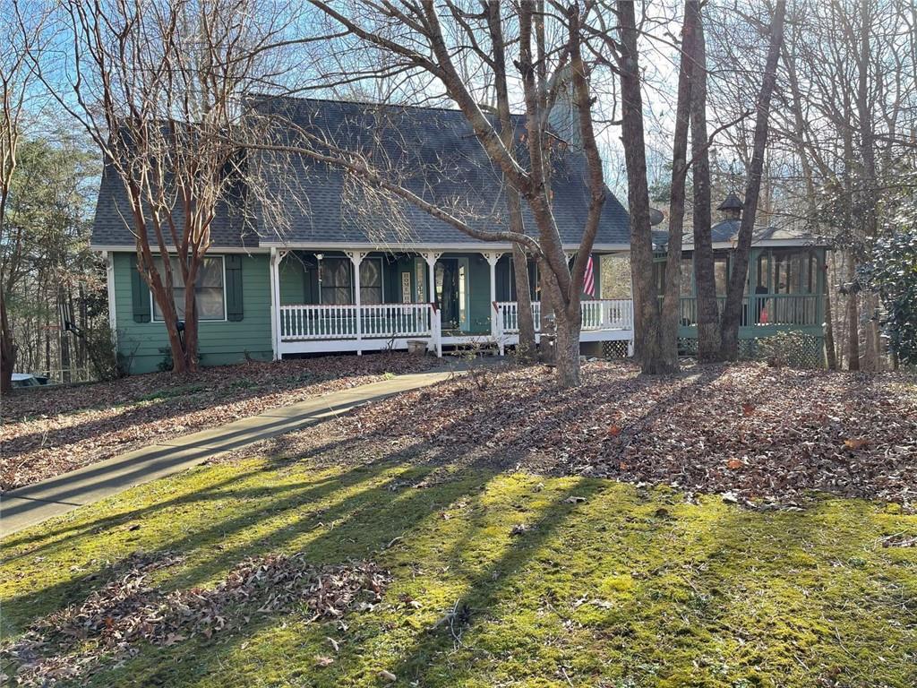 a front view of a house with a yard table and chairs