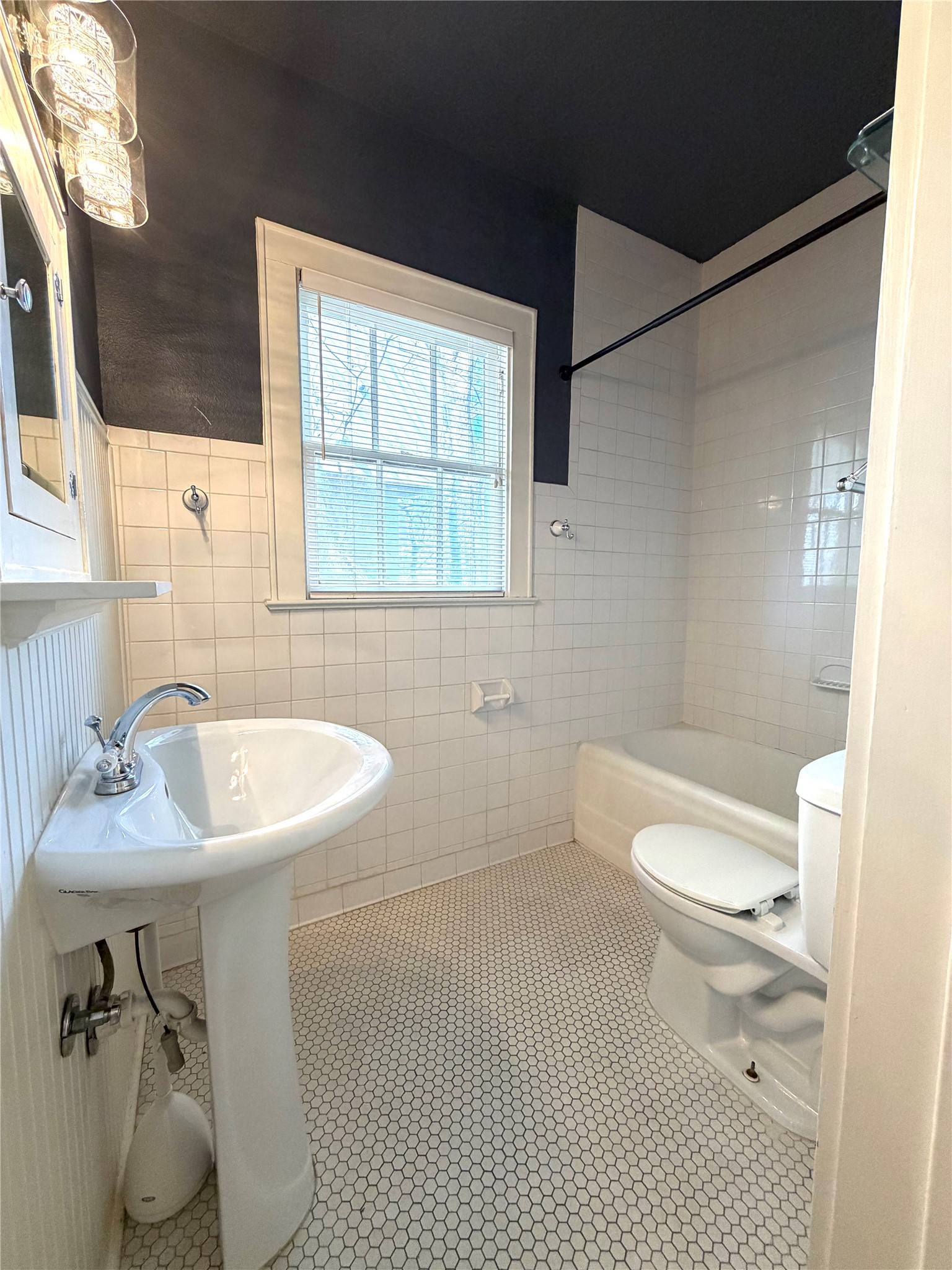 808 Edgecliff Terrace, Unit A Austin, TX 78704 - Photo 6 of 11 a bathroom with a sink toilet and shower