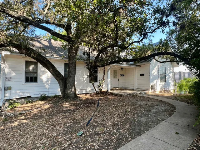a house view with a backyard space