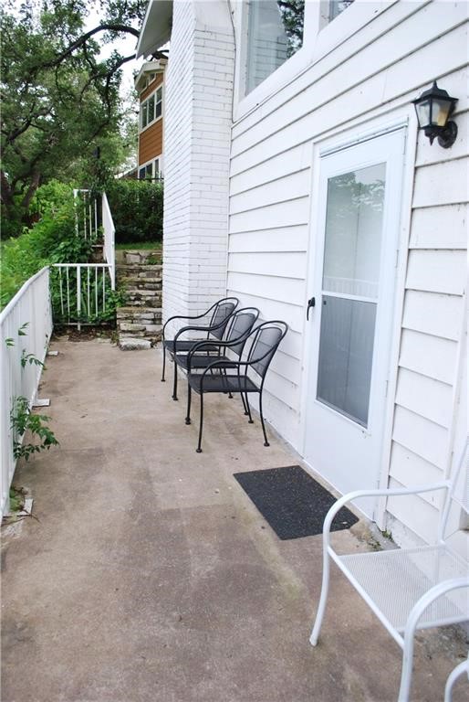 808 Edgecliff Terrace, Unit A Austin, TX 78704 - Photo 10 of 11 a backyard of a house with table and chairs