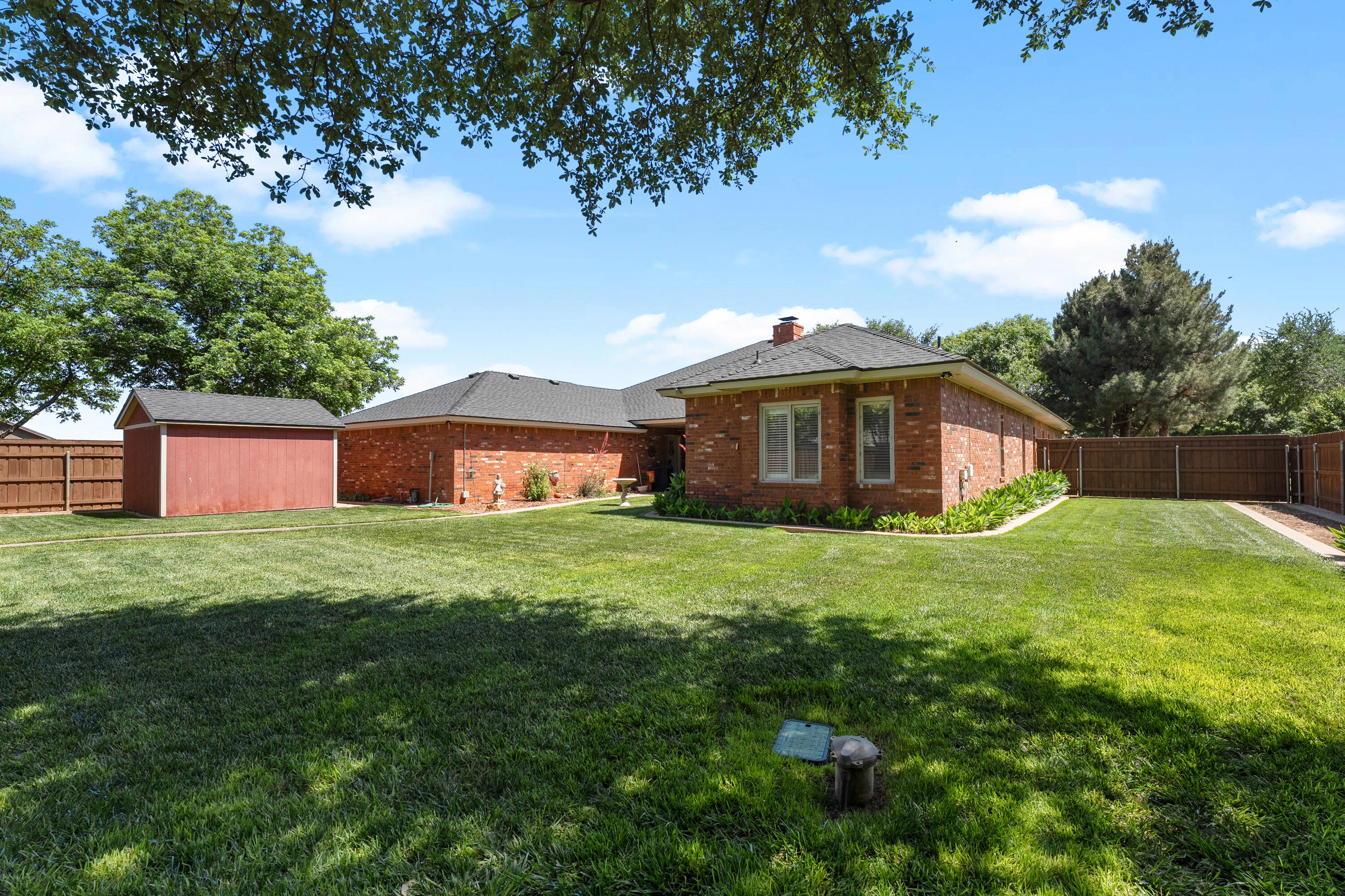 7402 95th Street Lubbock, TX 79424 - Photo 40 of 43 a view of a house with a yard