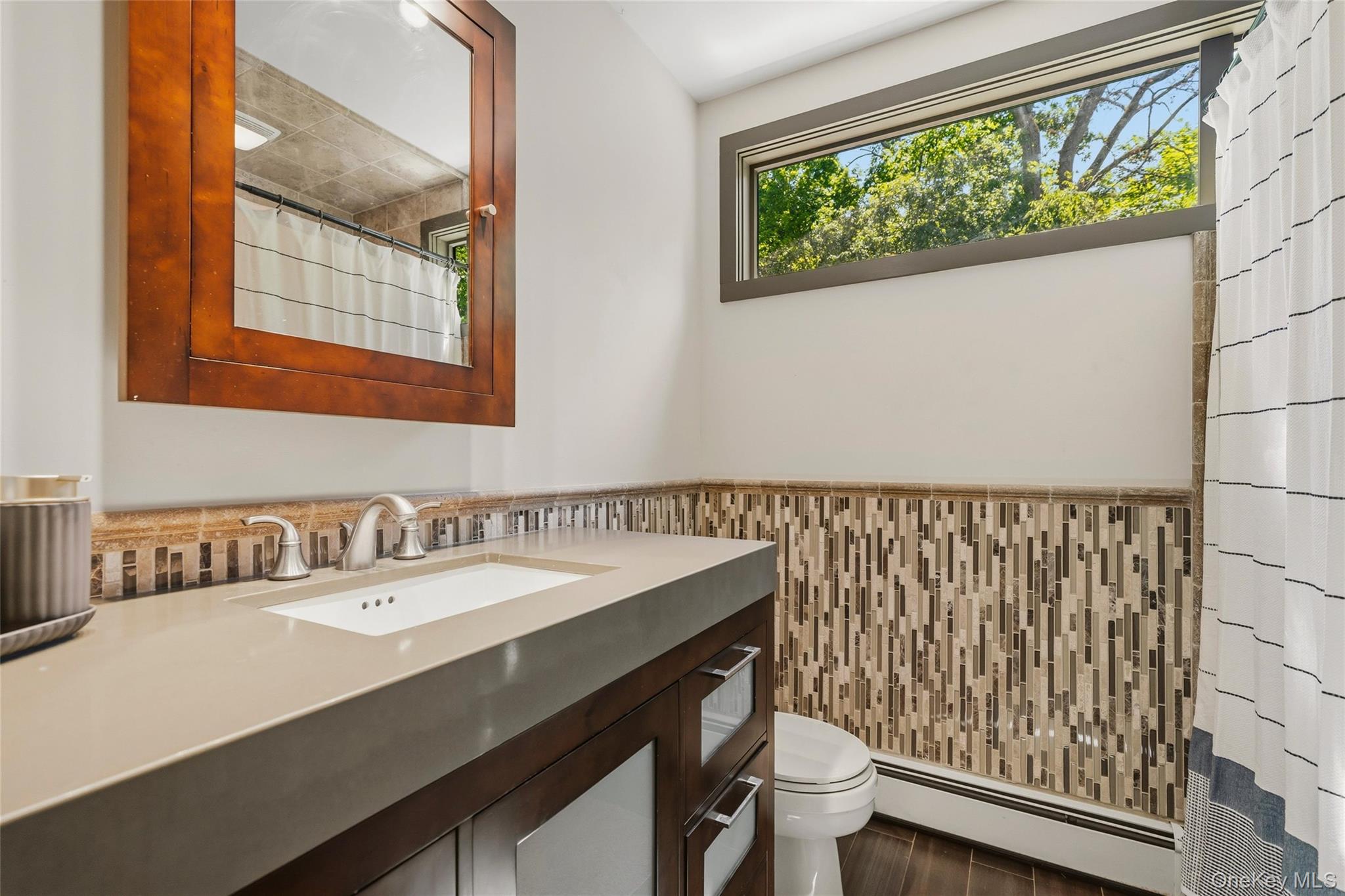 44 Sayer Road Blooming Grove, NY 10914 - Photo 13 of 39 a bathroom with a sink a toilet and a window