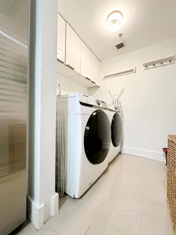 a utility room with dryer and washer