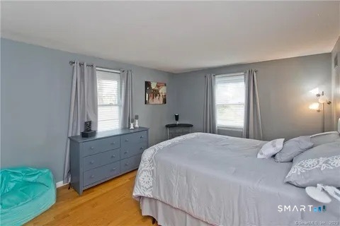 7 Riverview Street Enfield, CT 06082 - Photo 19 of 29 a bedroom with a bed and window with window