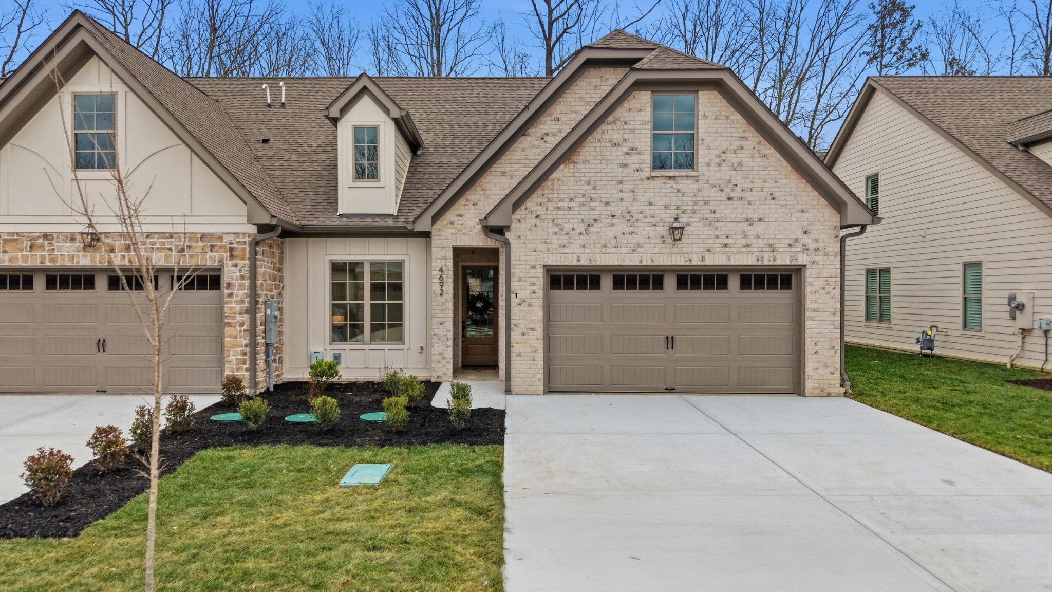 4692 Dempsey Way Chattanooga, TN 37419 - Photo 1 of 37 a front view of a house with a yard and garage