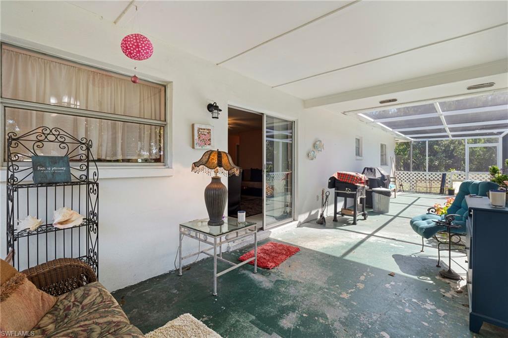 851 Barefoot Williams Road Naples, FL 34113 - Photo 20 of 35 a bedroom with furniture and a window