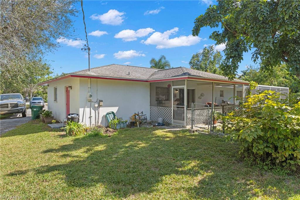 851 Barefoot Williams Road Naples, FL 34113 - Photo 22 of 35 a front view of a house with garden