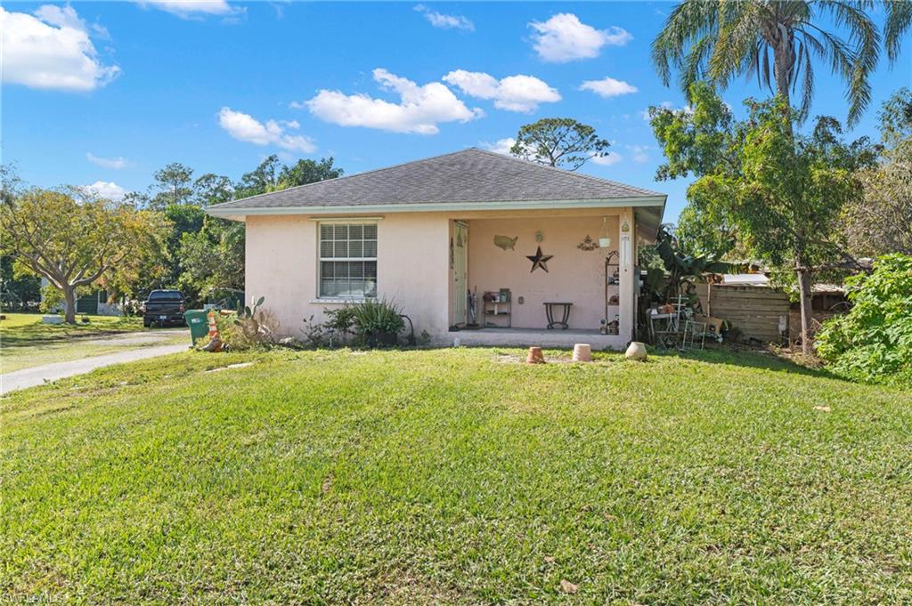 851 Barefoot Williams Road Naples, FL 34113 - Photo 23 of 35 a view of a house with a backyard