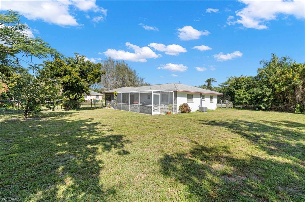 851 Barefoot Williams Road Naples, FL 34113 - Photo 26 of 35 a view of a house with a yard