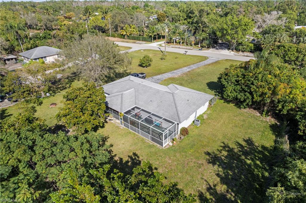 851 Barefoot Williams Road Naples, FL 34113 - Photo 29 of 35 an aerial view of a house with a yard and lake view