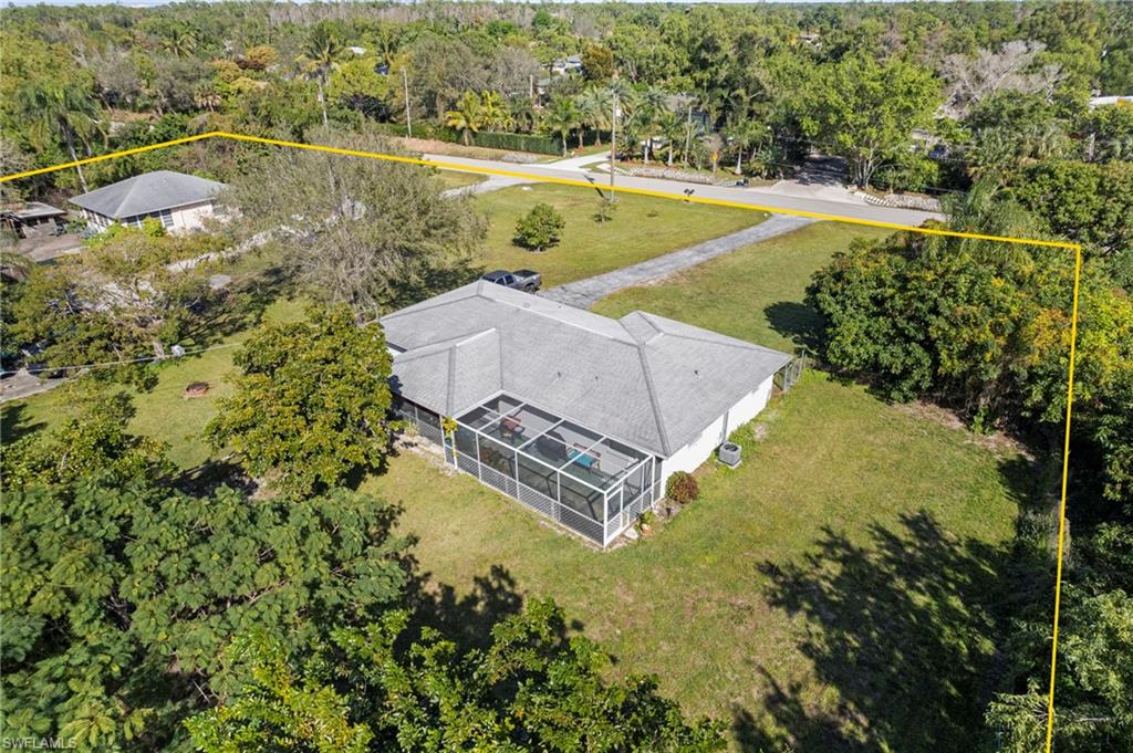 851 Barefoot Williams Road Naples, FL 34113 - Photo 30 of 35 an aerial view of a residential houses with outdoor space and trees