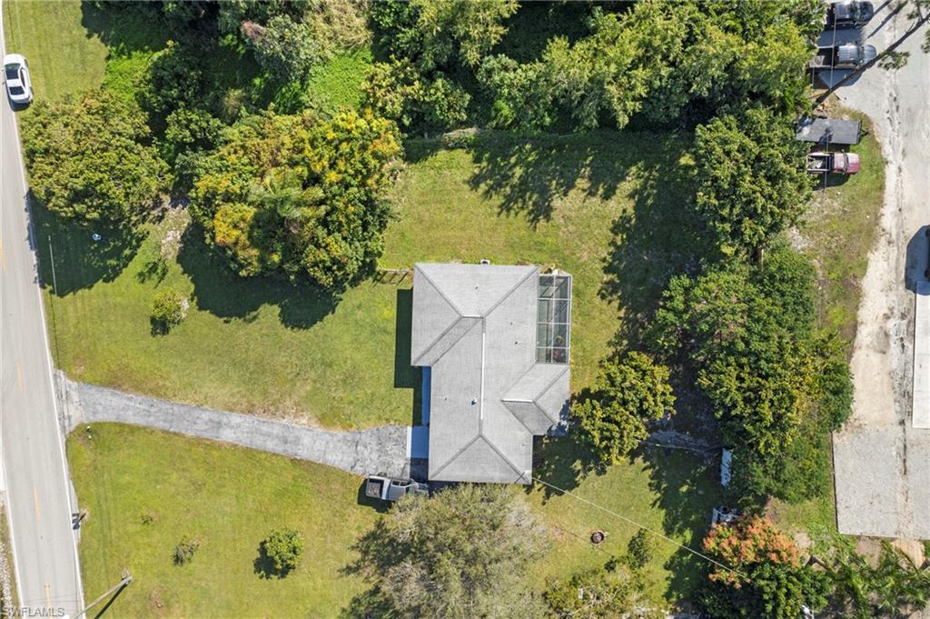 851 Barefoot Williams Road Naples, FL 34113 - Photo 31 of 35 an aerial view of a residential houses with yard