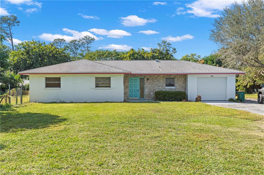 851 Barefoot Williams Road Naples, FL 34113 - Photo 4 of 35 a view of a house with a yard