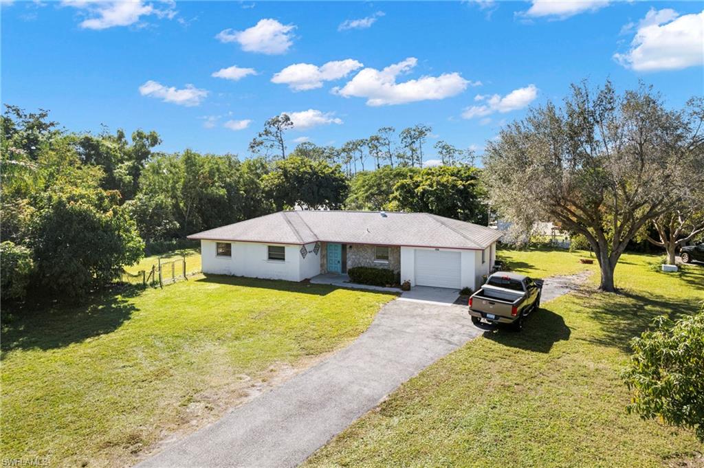 851 Barefoot Williams Road Naples, FL 34113 - Photo 6 of 35 a view of a house with pool and sitting area