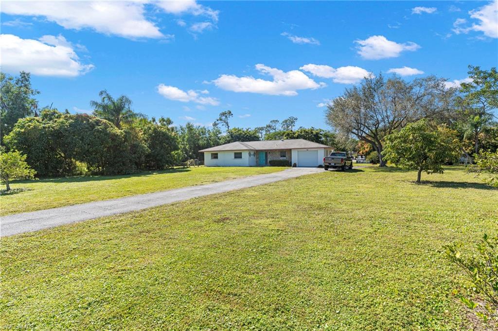 851 Barefoot Williams Road Naples, FL 34113 - Photo 8 of 35 a view of a swimming pool with an outdoor space and seating area