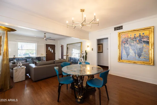 a kitchen with granite countertop white cabinets and window