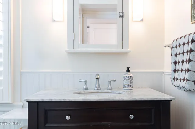 a view of a house with a yard patio and fire pit