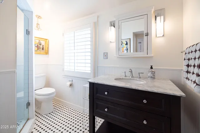 a front view of a house with a yard table and chairs